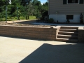 Landscaping retaining wall and concrete sidewalks